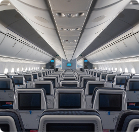 Mass Transit | Polymer Additives Group Interior of an Airplane Cabin with Rows of Passenger Seats, Representing a Mass Transit Fire Safety Application.