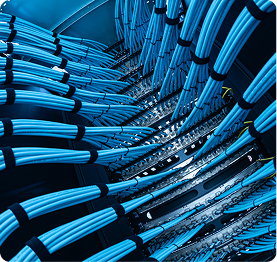 Wire & Cable | Polymer Additives Group Alt Text: Bundles of Blue Data Cables Organized in a Server Rack, Highlighting Additive Applications for Communication Safety.