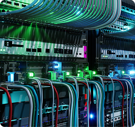Data Centers | Polymer Additives Group Alt Text: Organized Network Cabling and Server Hardware in a Data Center, Demonstrating a High-density Digital Environment.