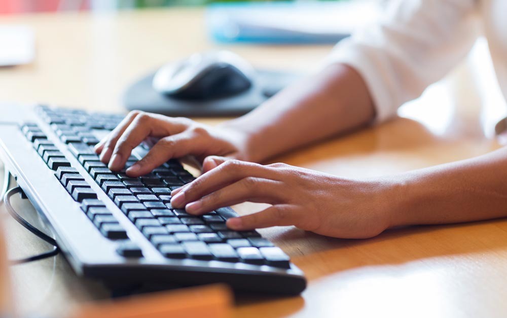 Hands-typing-keyboard | Polymer Additives Group Hands Type on a Black Keyboard
